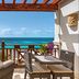 Zemi Beach House, Shoal Bay balcony with wicker seating and ocean view