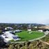 Nauset Beach Inn in Orleans with oceanfront views and a large green lawn beside the beach