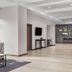 Hyatt House Boulder/Broomfield lobby with seating area, TV, and framed wall art in Broomfield
