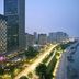 The Westin Wuhan Wuchang hotel with illuminated towers and riverfront city skyline in Wuhan