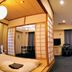 Asahikawa Park Hotel in Asahikawa room with twin beds, sitting area, TV, and Japanese-style divider