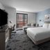 Hyatt House Raleigh Downtown/Seaboard Station guest room with king bed, sofa, desk and city view
