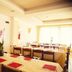 Hotel Park Venezia in Stra dining room set for a meal with tables, red placemats and large window light