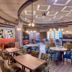 Grandeur Hotel Dubai lounge with colorful seating, tables, and hanging lights