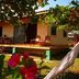 Fidelito Ranch & Lodge in Tambor with a wooden porch and tropical garden