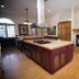 Victoria Resort And Bed & Breakfast in South Haven kitchen with island, fireplace, and hardwood floors