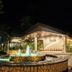 The Ritz Hotel at Garden Oases in Davao City with a lit entrance and fountain at night