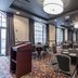 Hotel Indigo Nashville - The Countrypolitan By IHG meeting room with round tables and podium