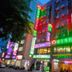Sin Fu Business Hotel in Taichung City exterior with neon signs and street-level entrance at night