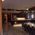 Center Hotel Toyota lobby lounge with marble table, bar counter, and dark chairs