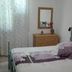 Casa Siciliana Altarbiah in Trabia: simple guest room with double bed, dresser, mirror, and curtained window