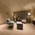 Hotel Nikko Tsukuba lounge with armchairs, ottoman and floor lamp in a softly lit sitting area