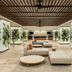 Fiesta Americana Acapulco Villas lobby with palm-print lighted panels and beige lounge seating in Acapulco