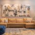 Hotel Stadt Kufstein lobby lounge with beige sectional sofa, blue ottoman, and abstract wall art