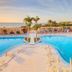 SBH Monica Beach Resort in Costa Calma with a large oceanfront pool and palm trees