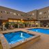 Element Sedona in Sedona with an outdoor pool and hot tub courtyard at dusk