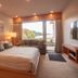 Harbour House Hotel in Ganges guest room with king bed, sofa, and window view