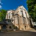 Sozo Hotel Nantes exterior beside historic stone church under blue sky