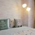 Taipei Star Hotel in Taipei City room with bed, decorative pillows, and floor lamp