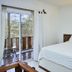 Otro Lado Lodge And Restaurant room in Santa Teresa with bed and balcony view
