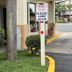 Hole Inn the Wall Hotel Fort Walton Beach entrance with thank-you sign and landscaping