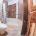 Supertramp Hostel Cusco bathroom in Cusco with shower-tub combo, toilet, and sink