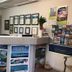 Emeraldene Inn & Eco-Lodge in Hervey Bay reception desk with brochure rack and travel certificates