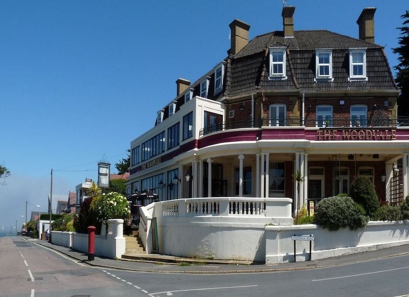 The Woodvale in Cowes, exterior of the hotel with a corner terrace and street view