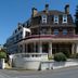 The Woodvale in Cowes, exterior of the hotel with a corner terrace and street view