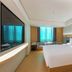 Ji Hotel Guiyang Fountain guest room with queen bed, large window, and sitting area in Guiyang