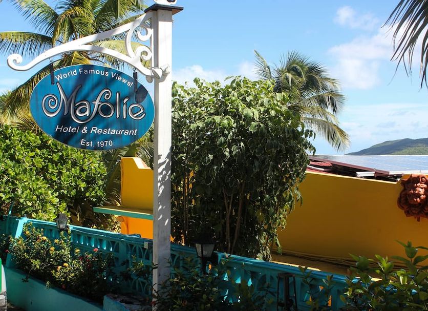 The Mafolie Hotel sign with tropical landscaping and ocean view on Saint Thomas Island