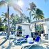 The Capitana Key West cabana-style poolside loungers under palm trees in sunny Key West
