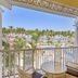 Bahia Principe Luxury Bouganville in La Romana balcony with pool, palm trees and ocean view