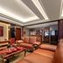 Grand Metropark Hotel Shangqiu lounge with leather sofas, tea table and decorative display
