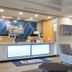 Holiday Inn Express & Suites Lake Zurich-Barrington lobby front desk with blue accent wall and seating