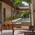 Ya'ax Hotel Boutique in Mérida with a courtyard pool, lounge chairs, and palm trees