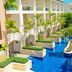 Hideaway at Royalton Punta Cana, Punta Cana: tropical resort pool with palm trees and swim-up suites