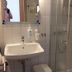 Hotel & Restaurant Wilhelm von Nassau bathroom with sink, mirror, and glass shower in Diez