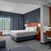 Courtyard by Marriott Pittsburgh Airport Settlers Ridge guest room with king bed, desk, and large window in Pittsburgh