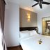 Hotel Richbaliz Selayang, Batu Caves: guest room with double bed, ceiling fan, and bathroom view through glass panel