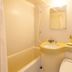 Fukuyama Terminal Hotel bathroom with tub, shower, sink, mirror, and toiletries in Fukuyama