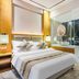Jiangnanxi Hotel (Guangzhou Qiaopanyu Square Metro Station) guest room with king bed and glass bathroom