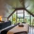 Domaine de Bellevue - Restaurant & Spa room with two beds and large triangular window in Neufmoutiers-en-Brie