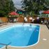 Victoria Resort And Bed & Breakfast in South Haven: outdoor pool with loungers and red umbrellas