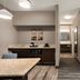 Hampton Inn & Suites Ft. Wayne-North room with kitchenette, TV and seating area in Fort Wayne