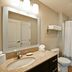 TownePlace Suites by Marriott Dallas Lewisville bathroom with vanity, mirror, toilet and shower-tub combo