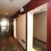 Chengdu Tianfu Lidu Hotel hallway in Chengdu with patterned carpet and wood-paneled walls