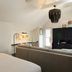 Winslow's Bungalows in Key West living room with sofa, TV, desk and vaulted ceiling