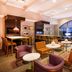Sheraton Baltimore Washington Airport Hotel - Bwi lounge with seating and large arched window in Linthicum Heights