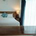 La Joya Del Lago Ajijic guest room with king bed, bedside lamps, and wooden table